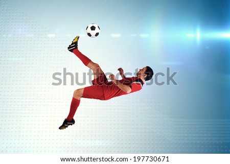 Football player in red kicking against technical screen with pixels