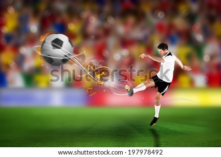 Football player in white kicking against blurry football pitch with crowd