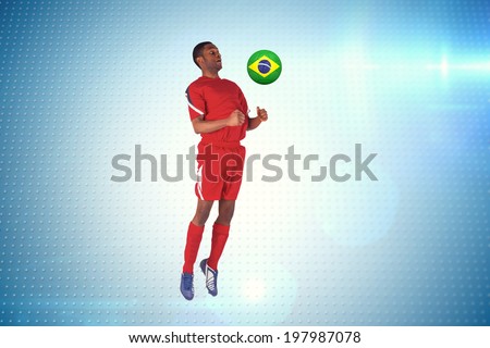 Football player in red jumping against technical screen with pixels