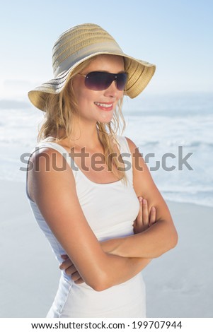 Gorgeous happy blonde posing at the beach on a sunny day