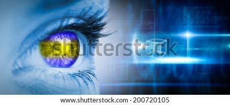 Green and yellow eye on blue face against blue technology design with cube