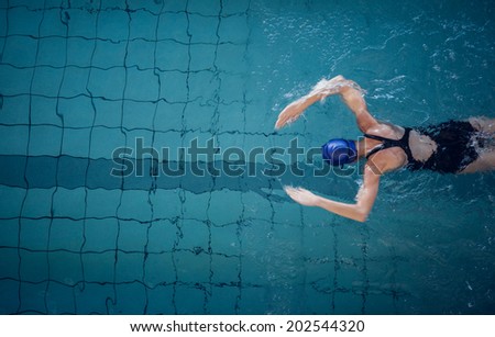Fit woman swimming in the pool at the leisure center Fit woman swimming in the pool at the leisure center
