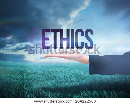 Businesswomans hand presenting the word ethics against blue sky over green field