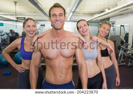 Handsome instructor is popular with the ladies at the gym