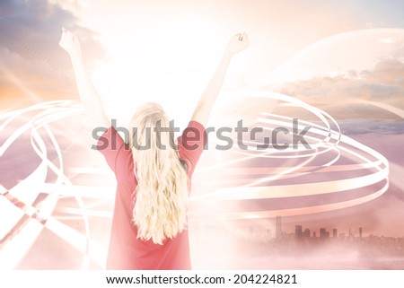 Cheering football fan in red against cityscape in the clouds