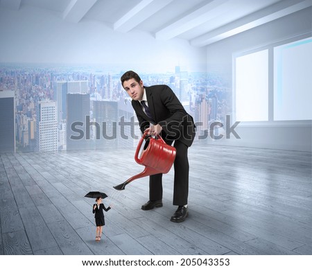 Businessman watering tiny businesswoman against city scene in a room