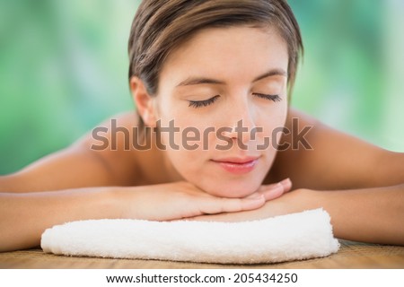 Close up of a beautiful young woman on massage table at health farm