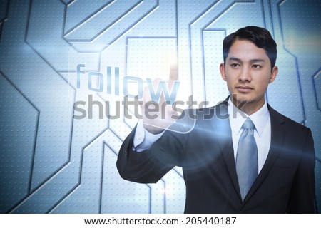 Businessman pointing to word follow against circuit board on futuristic background