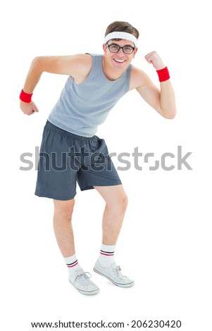 Geeky hipster posing in sportswear on white background