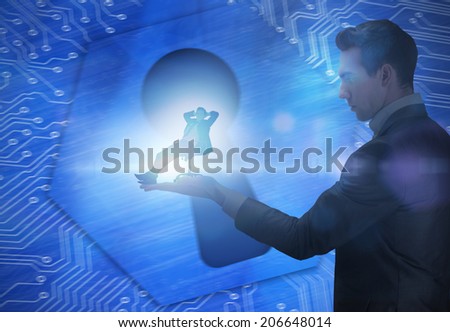 Composite image of businessman holding business man in swivel chair against keyhole graphic on blue background