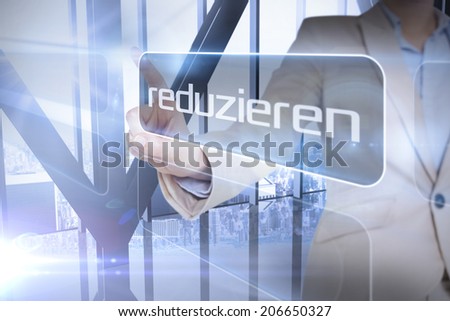 Businessman presenting the word reduce in german against room with large window looking on city