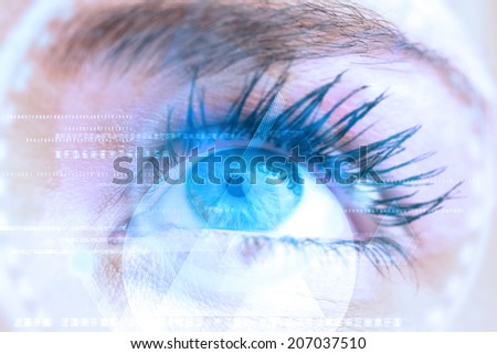 Composite image of close up of female blue eye against triangle design