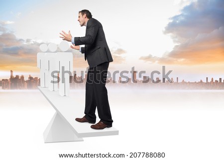 Scales weighing stressed businessman and stick men against cityscape and sky