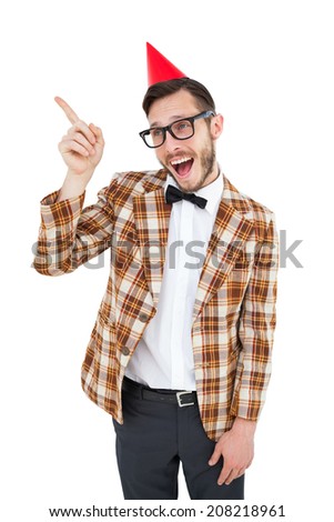 Geeky hipster in party hat pointing on white background
