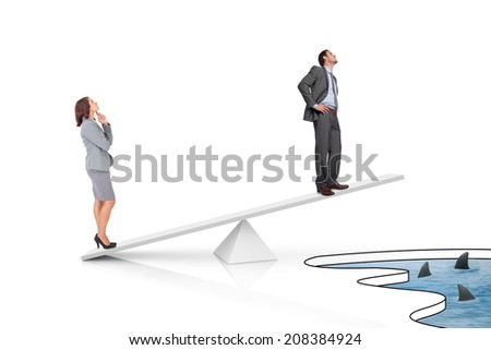 White scales measuring businessman and businesswoman over shark infested water