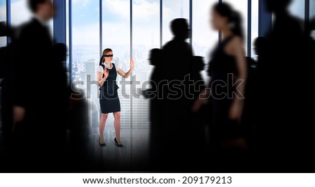 Business people walking in a blur against room with large window looking on city