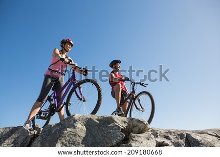 Active couple on a bike ride in the countryside on a sunny day