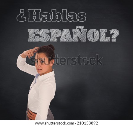 Composite image of worried businesswoman against blackboard, Do you speak Spanish?