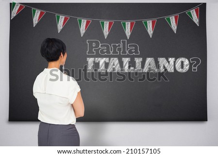Thoughtful businesswoman against black chalkboard, Do you speak Italian?