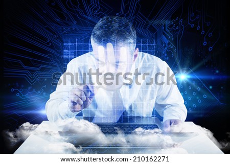 Mature businessman examining with magnifying glass against shiny blue hand print on circuit board