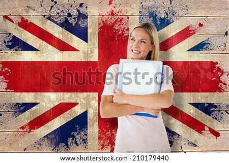 Mature student smiling against union jack flag in grunge effect