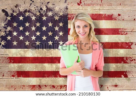 Young pretty student smiling against usa flag in grunge effect