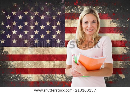Mature student smiling against usa flag in grunge effect