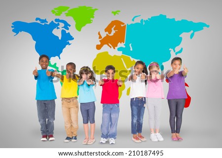 Elementary pupils smiling showing thumbs up against grey vignette with world map