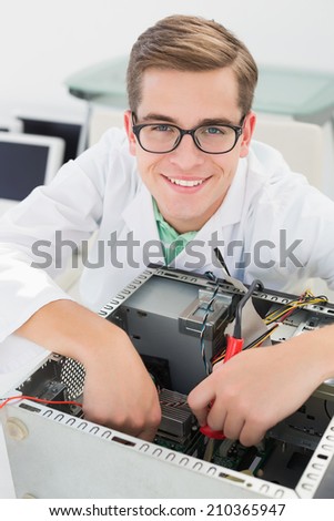 Technician working on broken cpu with soldering iron in his office