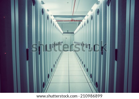 Empty hallway of server towers in large data center
