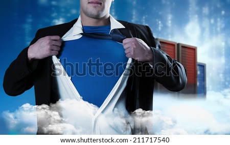 Businessman opening his shirt superhero style against cityscape on cloud