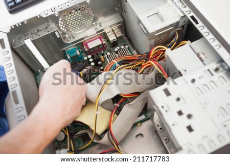 Computer engineer working on broken cpu in his office