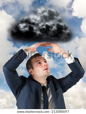 Businessman standing with hands over head against blue sky with white clouds