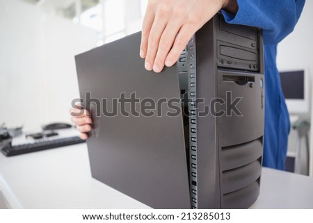 Computer engineer shutting up fixed console in his office