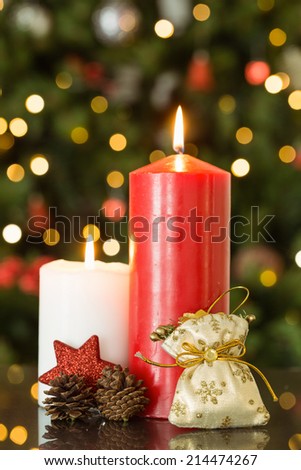 Focus on christmas candles and decorations at home in the living room