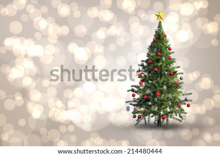 Christmas tree on white background against light glowing dots design pattern