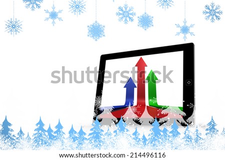 Snowflakes and fir trees against arrows on tablet screen