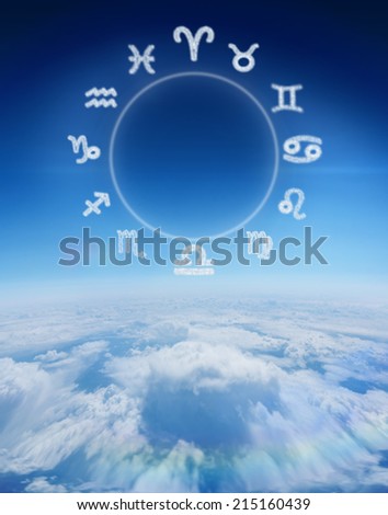 Zodiac chart against blue sky over clouds at high altitude