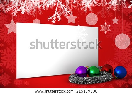 Composite image of poster with baubles against red snowflake design frame pattern