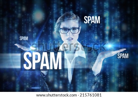 The word spam and businesswoman holding hand out in presentation against lines of blue blurred letters falling