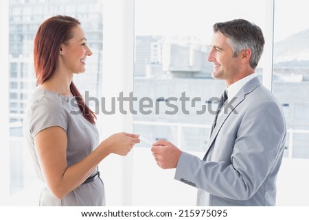 Business man giving his card to customer
