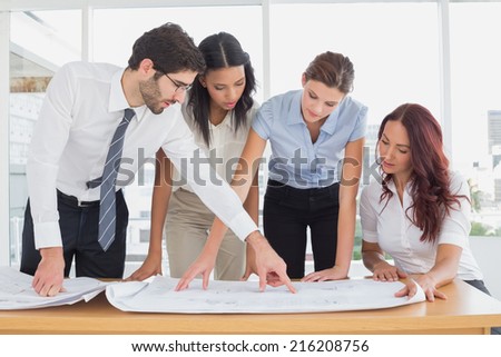 Business team reading work plans in the office