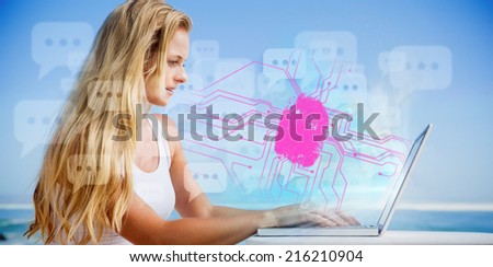 Pretty blonde using her laptop at the beach against fingerprint on circuit board
