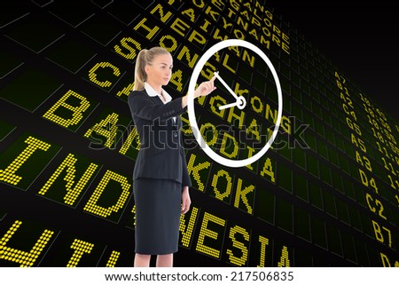 Composite image of businesswoman pointing to a white clock against black airport departures board for asia