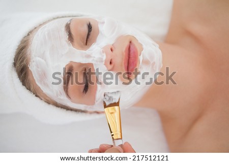 Beautiful blonde getting a facial treatment at the health spa