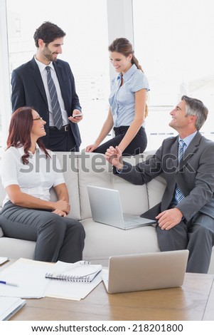 Business team talking about work in a team meeting