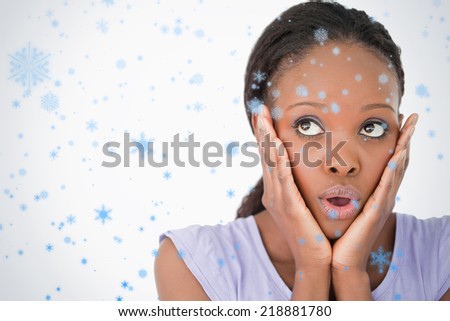 Close up of woman being afraid against a white background against snow falling