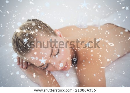 Pretty blonde with vacuum cups on her back against snow