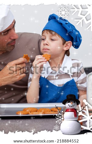 Father and son eating cookies against twinkling stars
