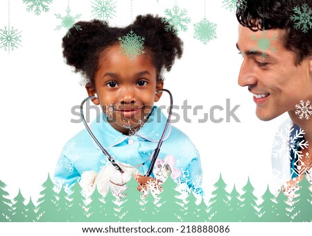 Attentive doctor playing with his patient against snowflakes and fir trees in green